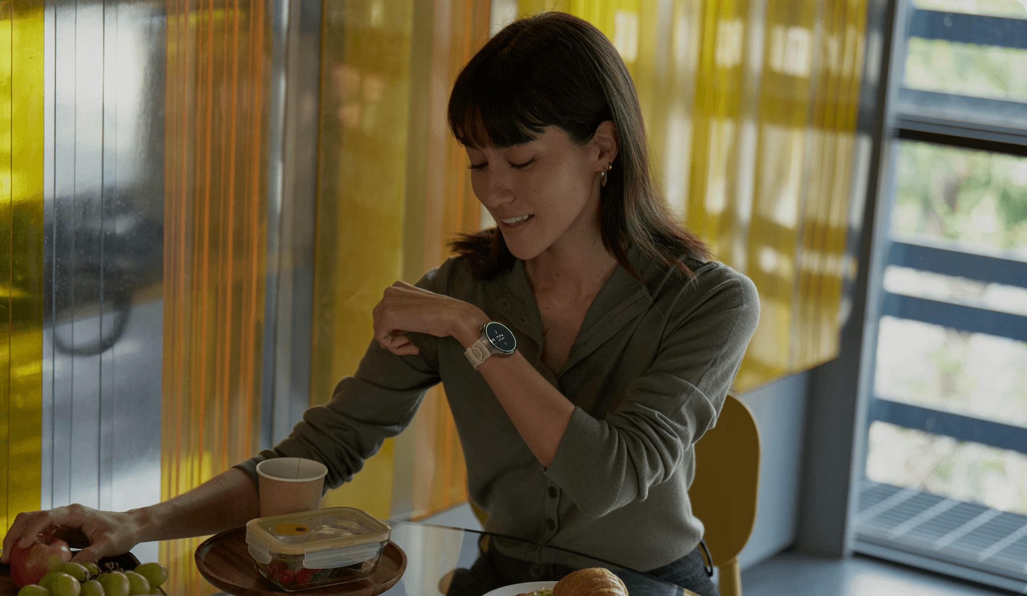 A person checking the Body Clock watch during lunch